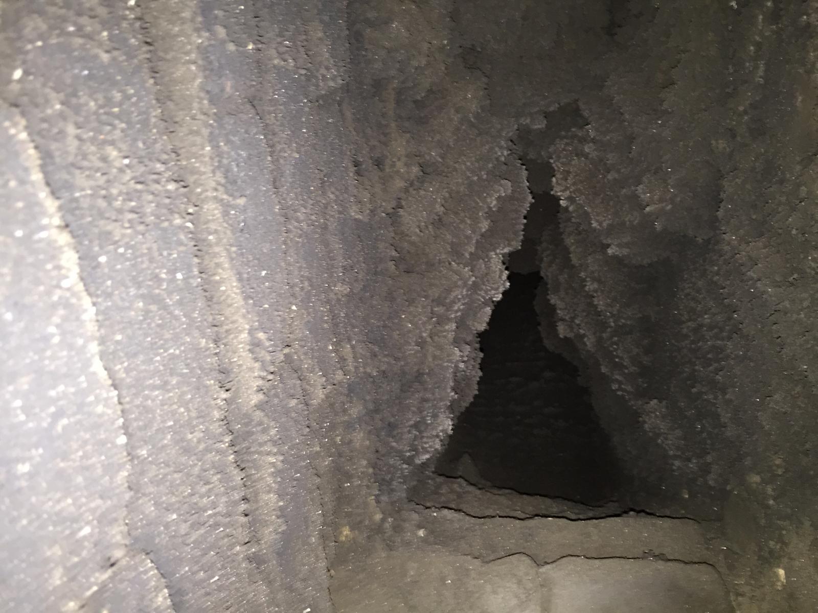 Inside view of sooty chimney before professional chimney sweep — Norwich, Norfolk