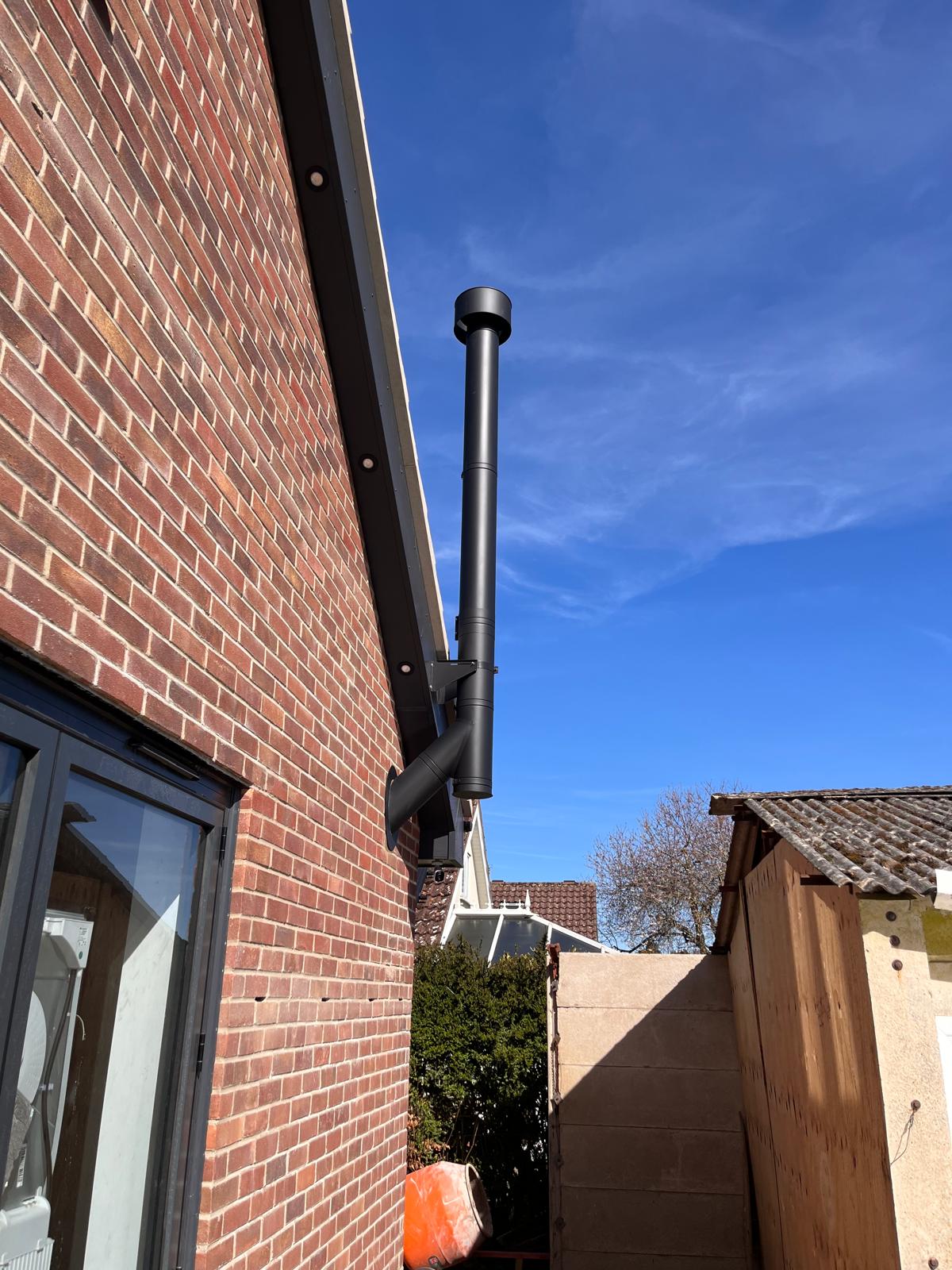 External black twin wall flue installation on brick house — Norwich and Norfolk