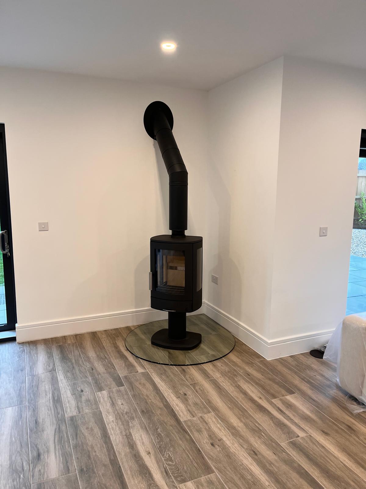 Close up of external flue with timber cladding finish — Watmore's Woodburners, Norfolk