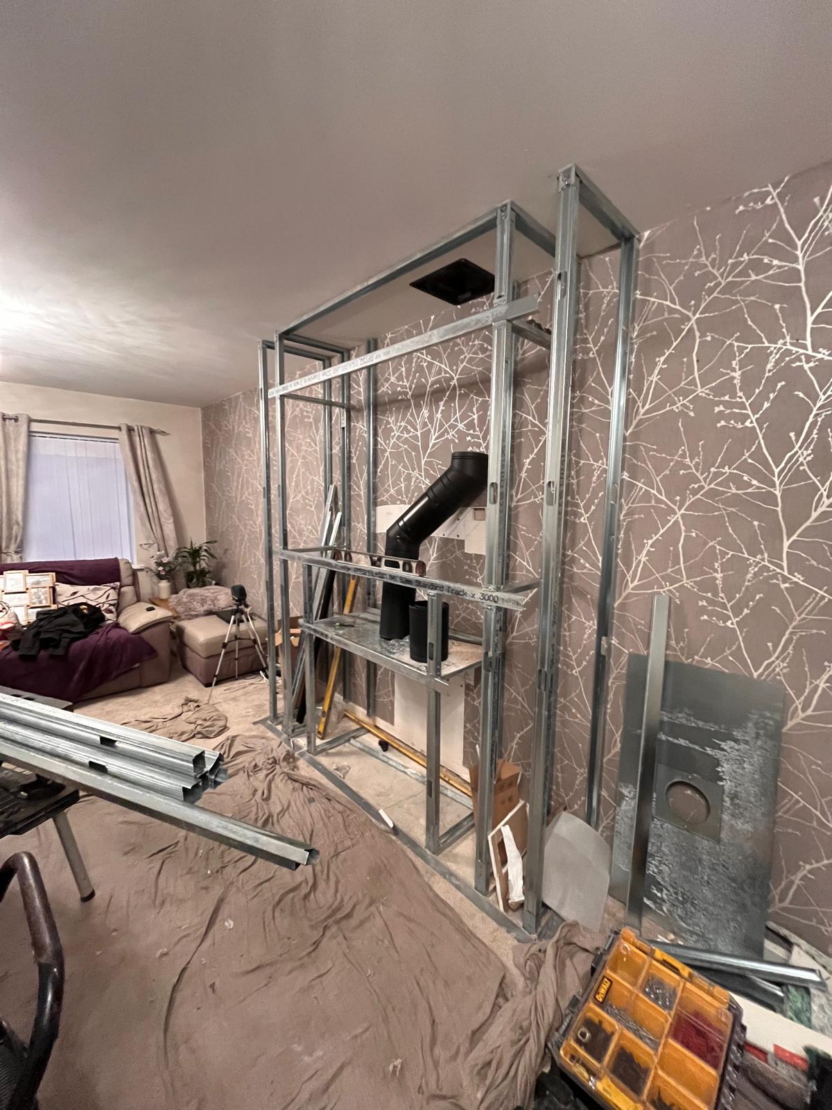 Wood burning stove and fireplace beam installation with drylining — Norfolk